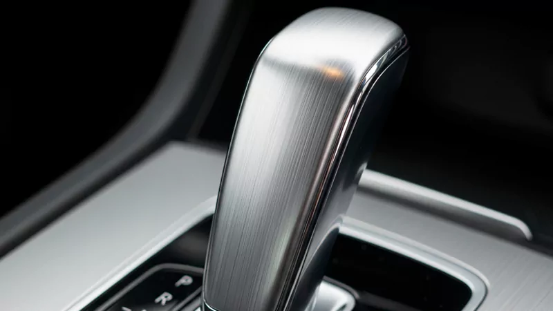 The brushed finish of the car gearshift lever The brushed finish of the car gearshift lever